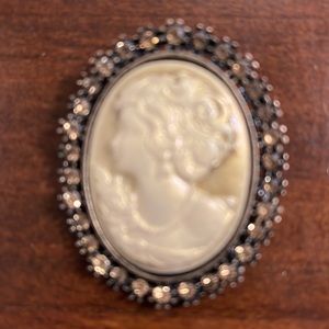 Cameo brooch with bronze beads. Dimensions 1.75x1.75 by Hobby Lobby. Not worn.